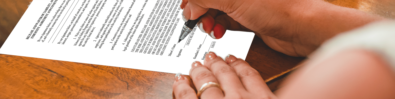 image of the the waiver and release from being signed by a woman