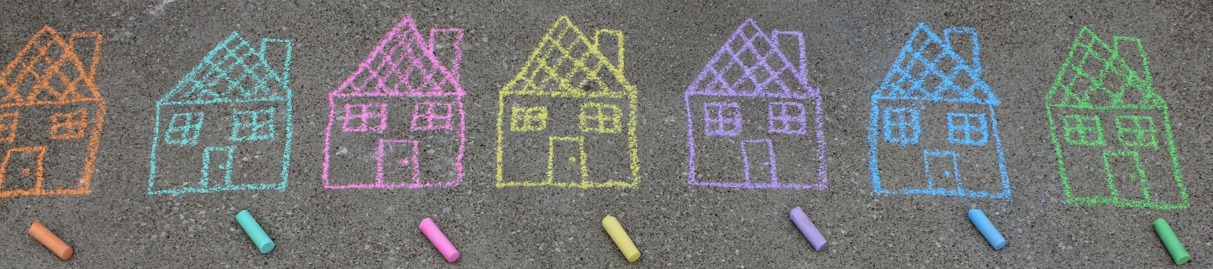 seven houses drawn in orange, teal, pink, yellow, lavender, blue, and green chalk