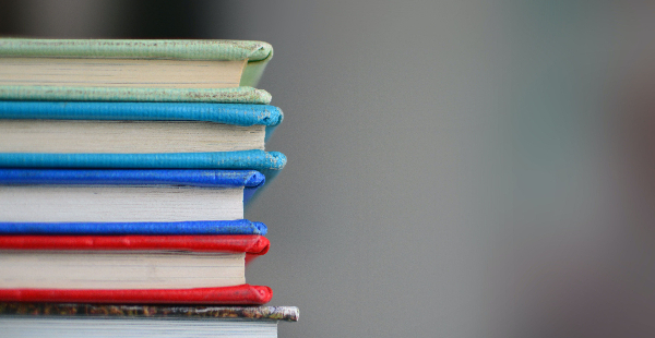 stack of books with colorful bindings